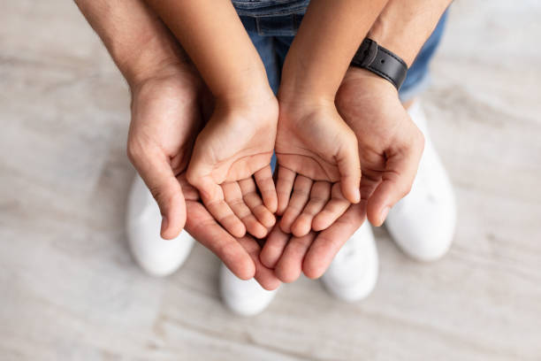 Child Custody - Father and Child Hands