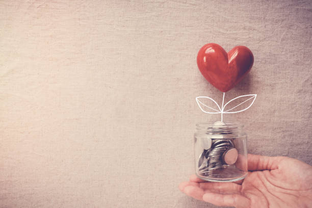 Charitable Giving - Jar filled with coins and a heart