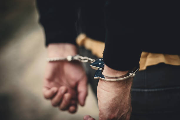 Deferred Adjudication - Man in handcuffs behind his back